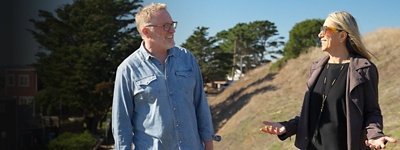 Dan Duane and Carrie Varoquiers having a conversation outside
