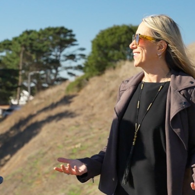 Dan Duane and Carrie Varoquiers having a conversation outside