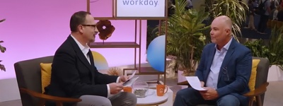 Two men talking on a TV sound stage