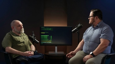 Image shows Workday Extend developers Chris Humphrey and Clint Harwood, from Strada, in conversation.