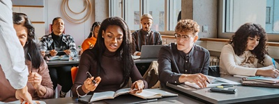 Students sitting at desks in a classroom setting