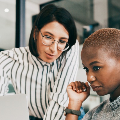 Two women looking at laptop