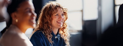 Two women smiling at work