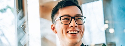 Smiling employee at a work station
