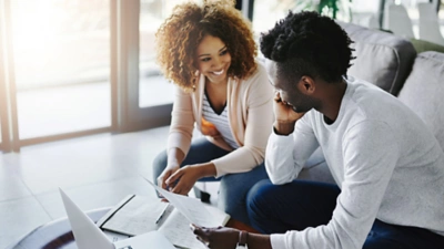 Man and woman looking at data on device