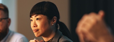 A woman in a HR meeting listening attentively