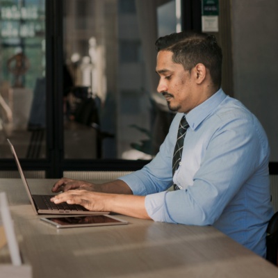 Woman and man sitting across from each other in office