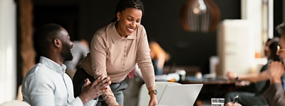 Woman and man in office smiling