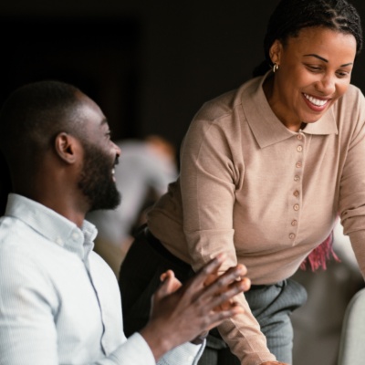 Woman and man in office smiling