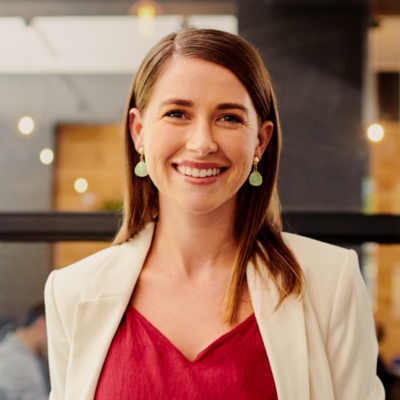 Women in blazer smiling into camera