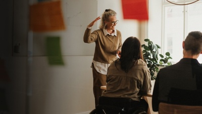 People having a meeting in an office discussing a plan or strategy