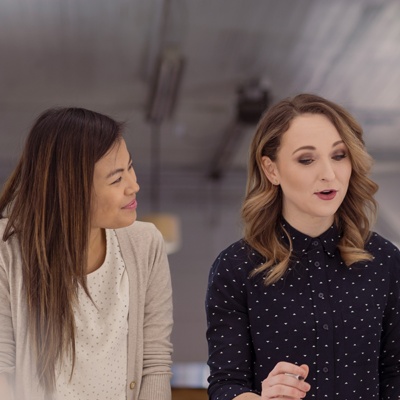 Woman speaking to colleagues