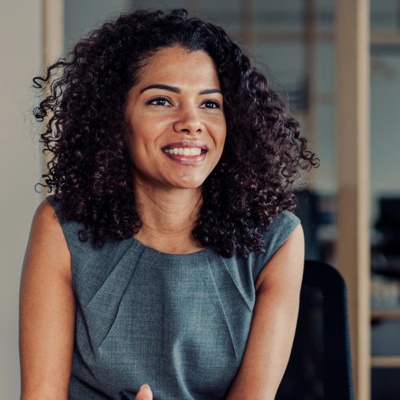 A woman talking to her two colleagues