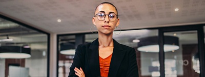 Woman with glasses looking into camera