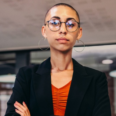 Woman with glasses looking into camera