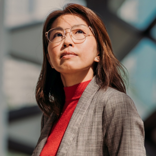 Woman with glasses looking up
