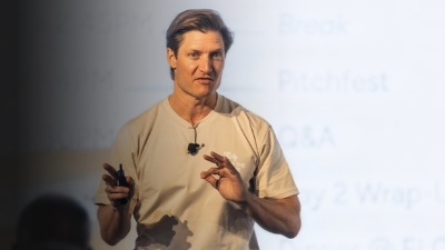 Josh Secrest speaking to an audience.